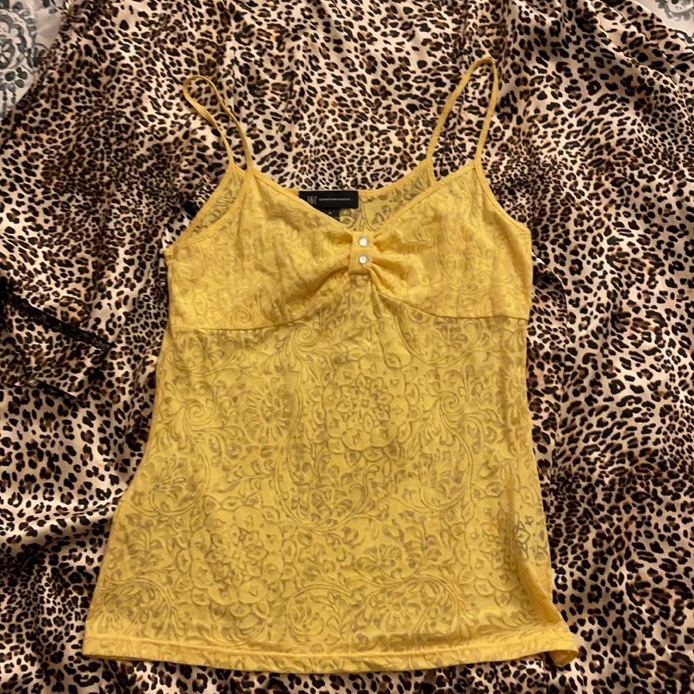 Sexy tank top with bling buttons.
